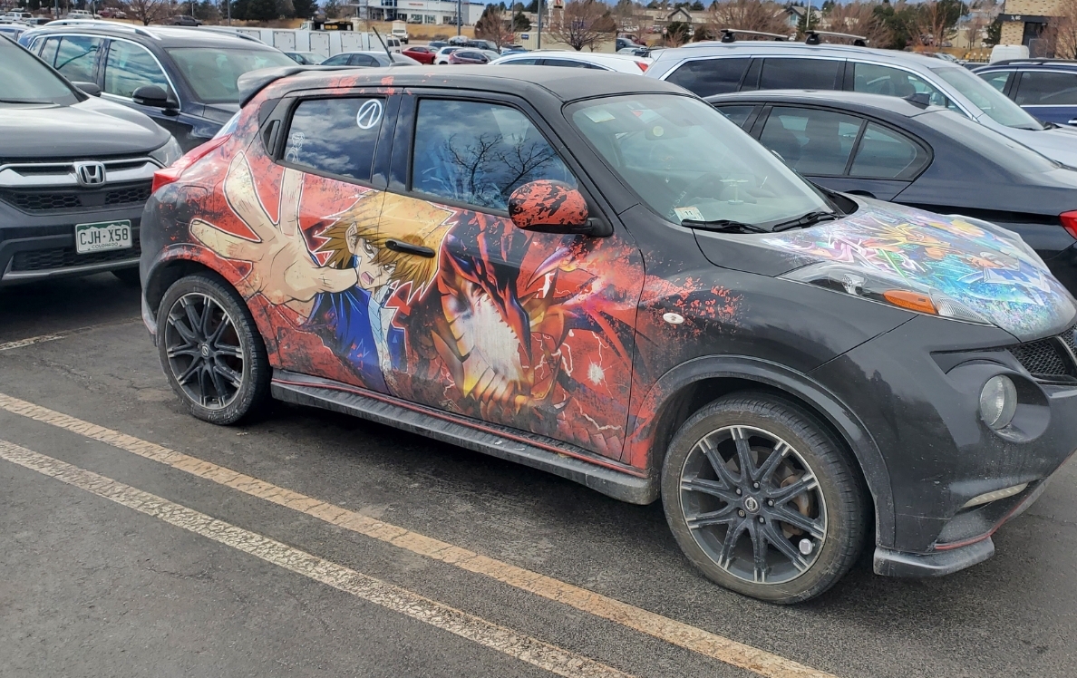 Car w/ anime print.