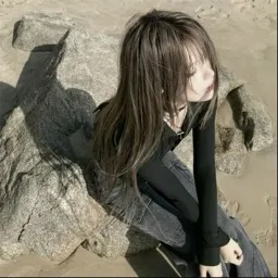 egirl sitting on rock